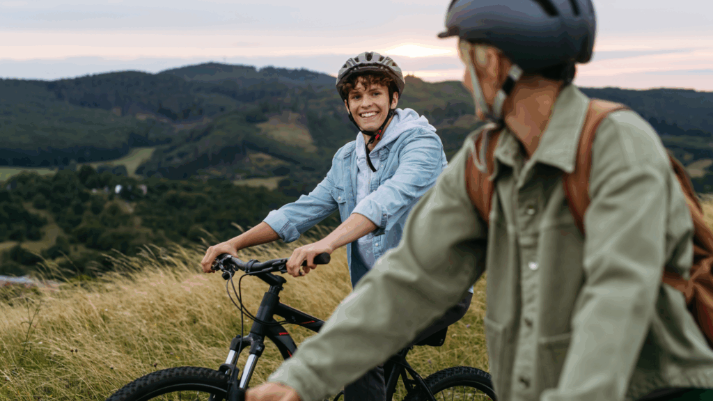 Two teens on mountain bikes exploring nature