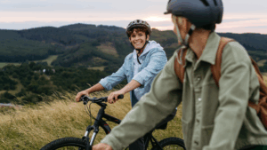 Two teens on mountain bikes exploring nature