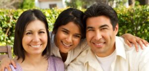 Family portrait showing Mom, daughter, and Dad