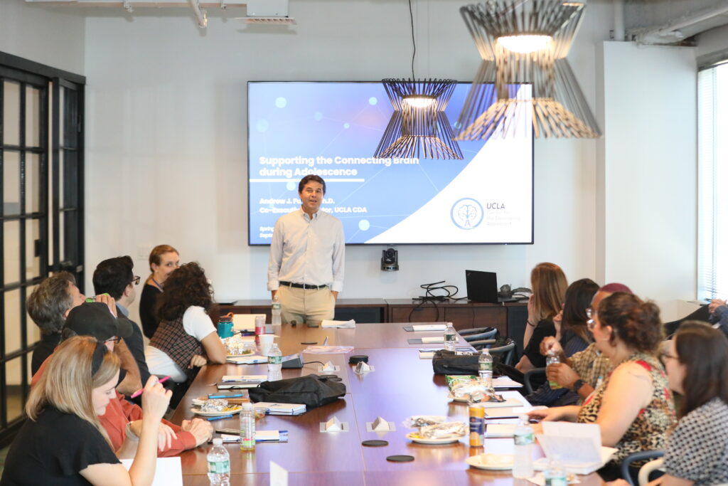 Andrew J. Fuglini presenting to a group of policymakers, educators, and youth-serving advocates in Philadelphia, 2024